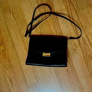 Black and Gold Crossbody Bag with Structured Design